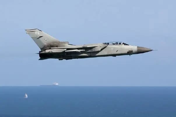 A Royal Air Force fast jet in low-level flight over the sea